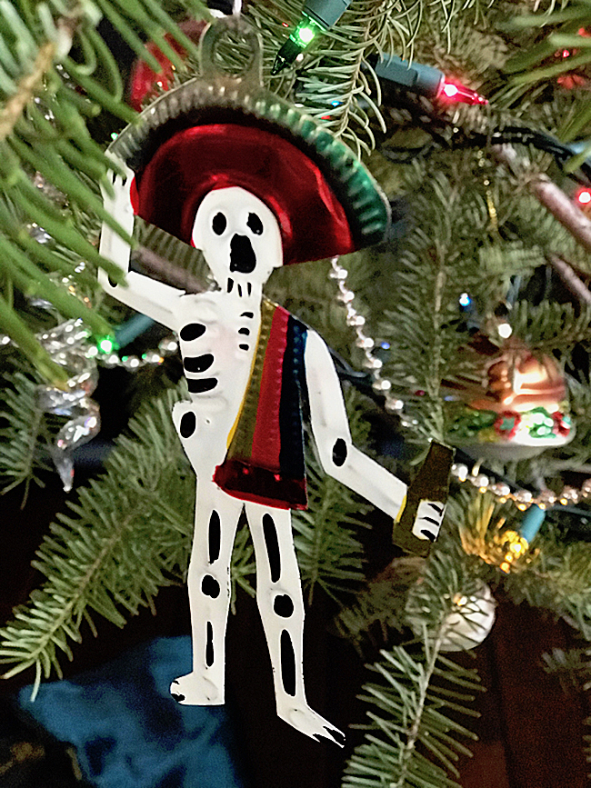 Christmas tree ornament, skeleton wearing sombrero and holding bottle of tequila